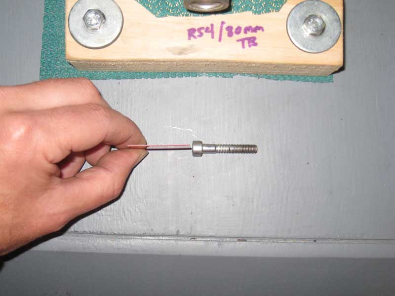 Harris Teeter card next to manifold bolt